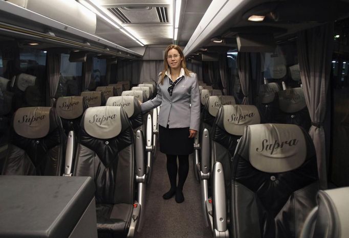 Tania Leon, a 29 year-old stewardess, poses for a picture inside a bus in Santiago de Compostela, Spain May 9, 2012. Leon studied psychology at the University of Santiago de Compostela and received a degree in 2006. She was hoping to find a job as a psychologist but has been working as a stewardess for the last two years.