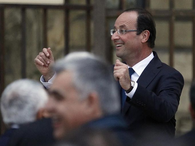 Hollande, Socialist Party candidate for the 2012 French presidential election, attends a campaign rally in Nimes