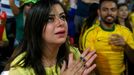 A fan reacts in a cafe in the town of Itu as she watches the 2014 World Cup opening game between Brazil with Croatia June 12, 2014. REUTERS/Maxim Shemetov (BRAZIL - Tags: