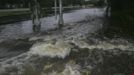 Flood waters rush over a train crossing in Live Oak, Florida, June 26, 2012. Tropical Storm Debby weakened to a tropical depression after it drifted ashore on Florida's Gulf Coast on Tuesday, even as it dumped more rain on flooded areas and sent thousands of people fleeing from rising rivers. Picture taken July 26. REUTERS/Phil Sears (UNITED STATES - Tags: DISASTER ENVIRONMENT) Published: Čer. 27, 2012, 1:42 odp.