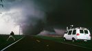 ¨Storm Chaser Filming Tornado Near Happy in Texas This tornado outside the sleepy Texas town of Happy killed two people and destroyed a church as it churned west of the town. Chasers Eric Nguyen and Dave Fick (pictured) captured the large monster from the north.