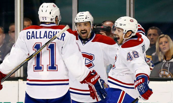 May 14, 2014; Boston, MA, USA; Montreal Canadiens center Daniel Briere (48) celebrates his goal with teammates center Tomas Plekanec (14) and right wing Brendan Gallagher