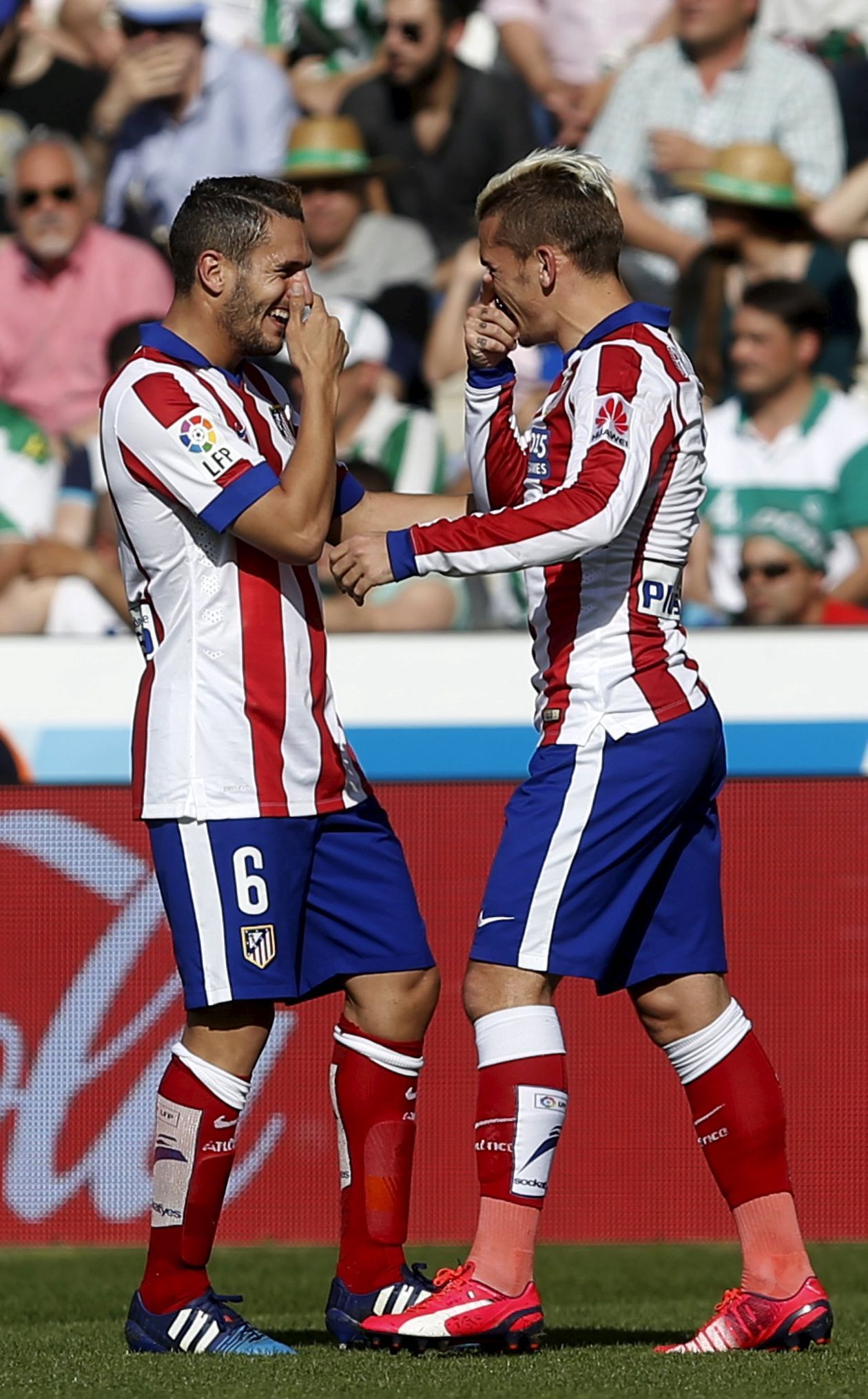 Atletico Madrid's Antoine Griezmann and team mate Koke celebrate after scoring a goal against Cordoba during their Spanish First Division soccer match at El Arcangel stadium in Cordoba