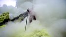 An Indonesian sulphur miner collects sulphur from the crater atop the Ijen volcano in Banyuwangi, on East Java, on December 15, 2009. An active vent at the Ijen volcano 2