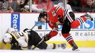 Boston Bruins Johnny Boychuk (55) is hit along the boards by Chicago Blackhawk Andrew Shaw (65) in the first period during Game 2 of their NHL Stanley Cup Finals hockey s