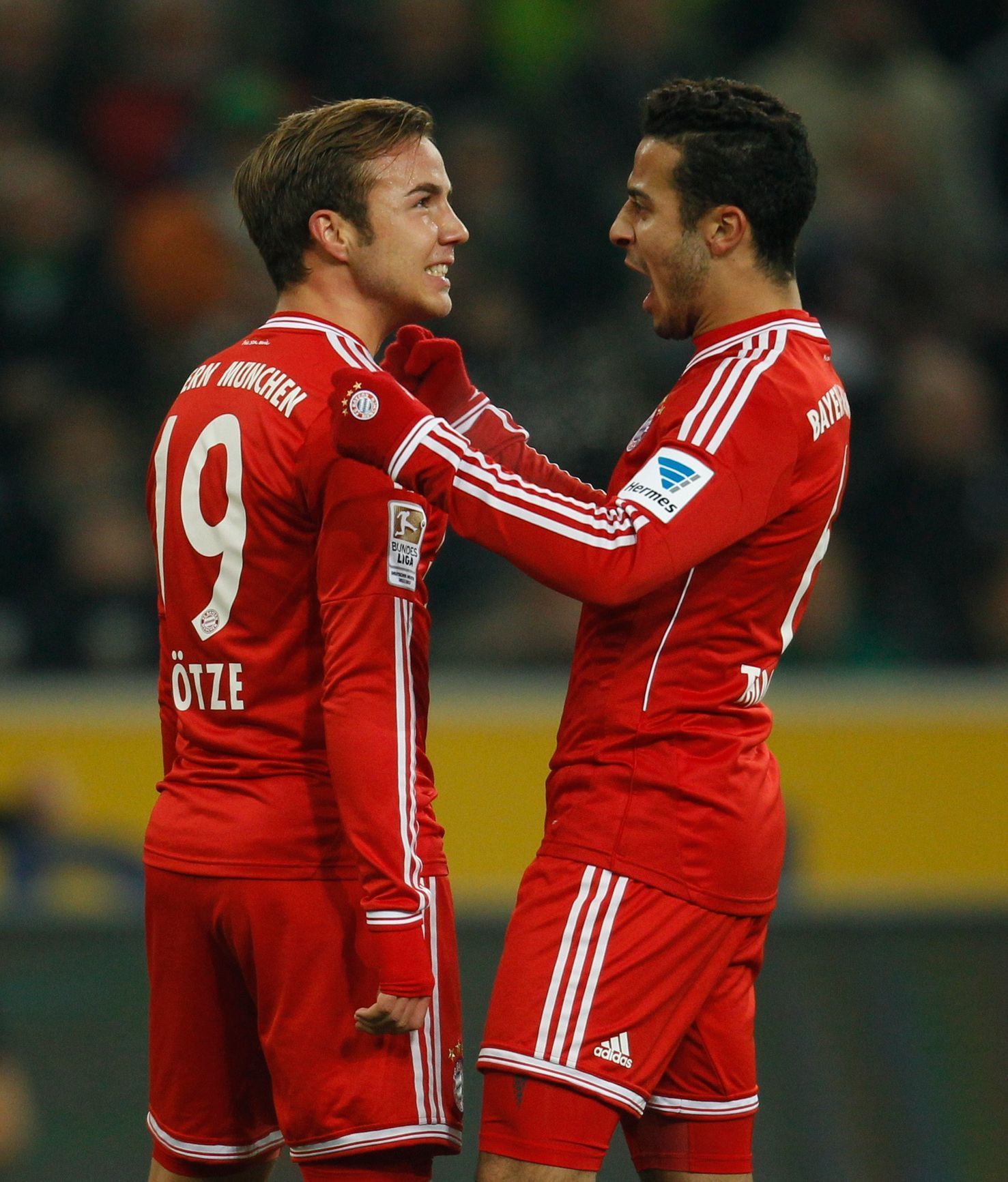 Bayern Munich's Goetze and Thiago celebrate a goal against Borussia Moenchengladbach during the German first division Bundesliga soccer match in Moenchengladbach