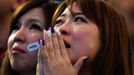 Japan's supporters react after Japan lost their 2014 World Cup Group C soccer match against Ivory Coast during a public viewing event at Tokyo dome in Tokyo June 15, 2014