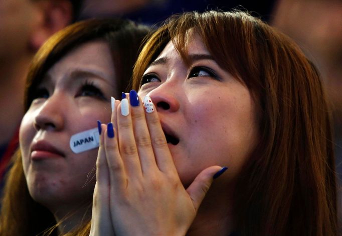 Japan's supporters react after Japan lost their 2014 World Cup Group C soccer match against Ivory Coast during a public viewing event at Tokyo dome in Tokyo June 15, 2014