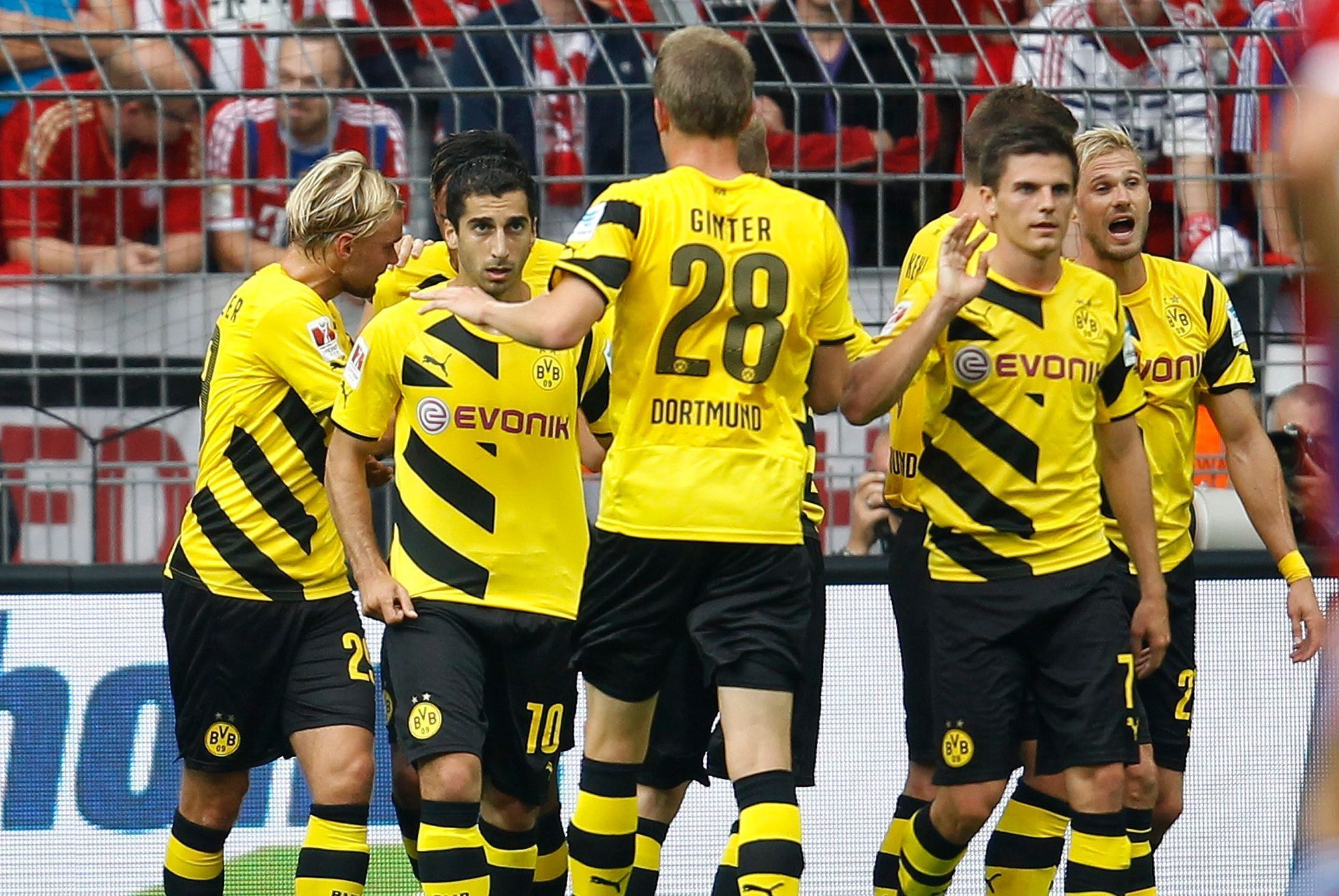 Borussia Dortmund's Mkhitaryan and teammates celebrate a goal against Bayern Munich during their SuperCup 2014 soccer match in Dortmund