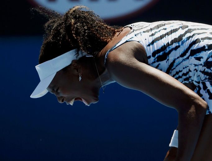 Venus Williams of the U.S. reacts during her women's singles match against Ekaterina Makarova of Russia at the Australian Open 2014 tennis tournament in Melbourne January