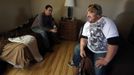 Oil industry workers, Matt Jensen (L) and Chris Skinner relax in their accommodations at a so-called man camp outside Watford, North Dakota, October 20, 2012. Thousands of people have flooded into North Dakota to work in state's oil drilling boom. Picture taken October 20, 2012. REUTERS/Jim Urquhart (UNITED STATES - Tags: ENERGY BUSINESS EMPLOYMENT) Published: Říj. 22, 2012, 1:41 odp.