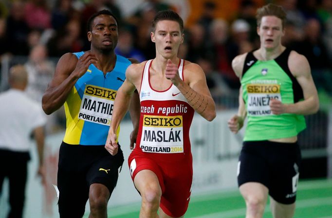 Pavel Maslak of the Czech Republic (C) runs in a heat during the men's 400 meter event at the IAAF World Indoor Athletics Championships in Portland.