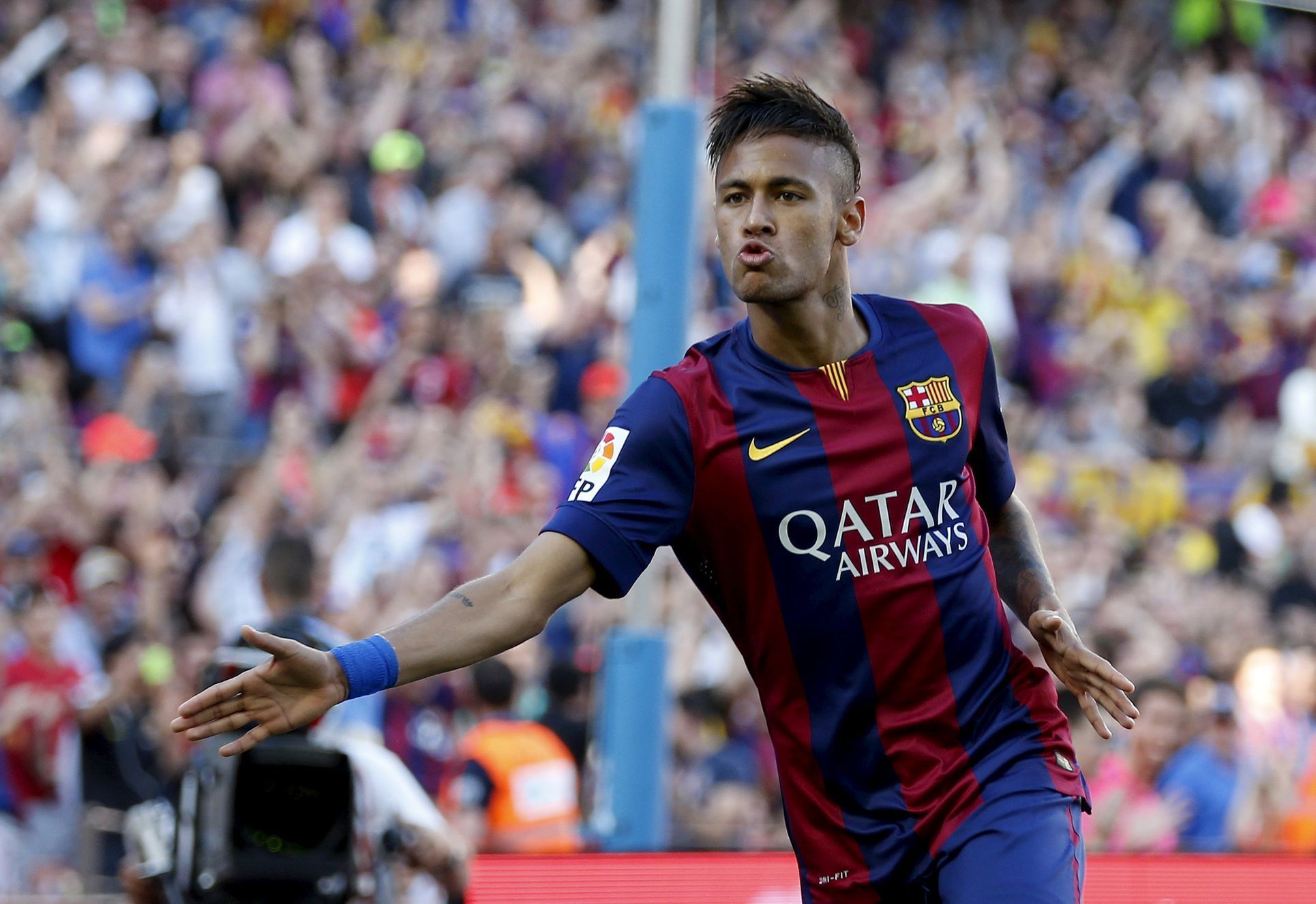 Barcelona's Neymar celebrates his goal against Real Sociedad during their Spanish first division soccer matchat Nou Camp stadium in Barcelona