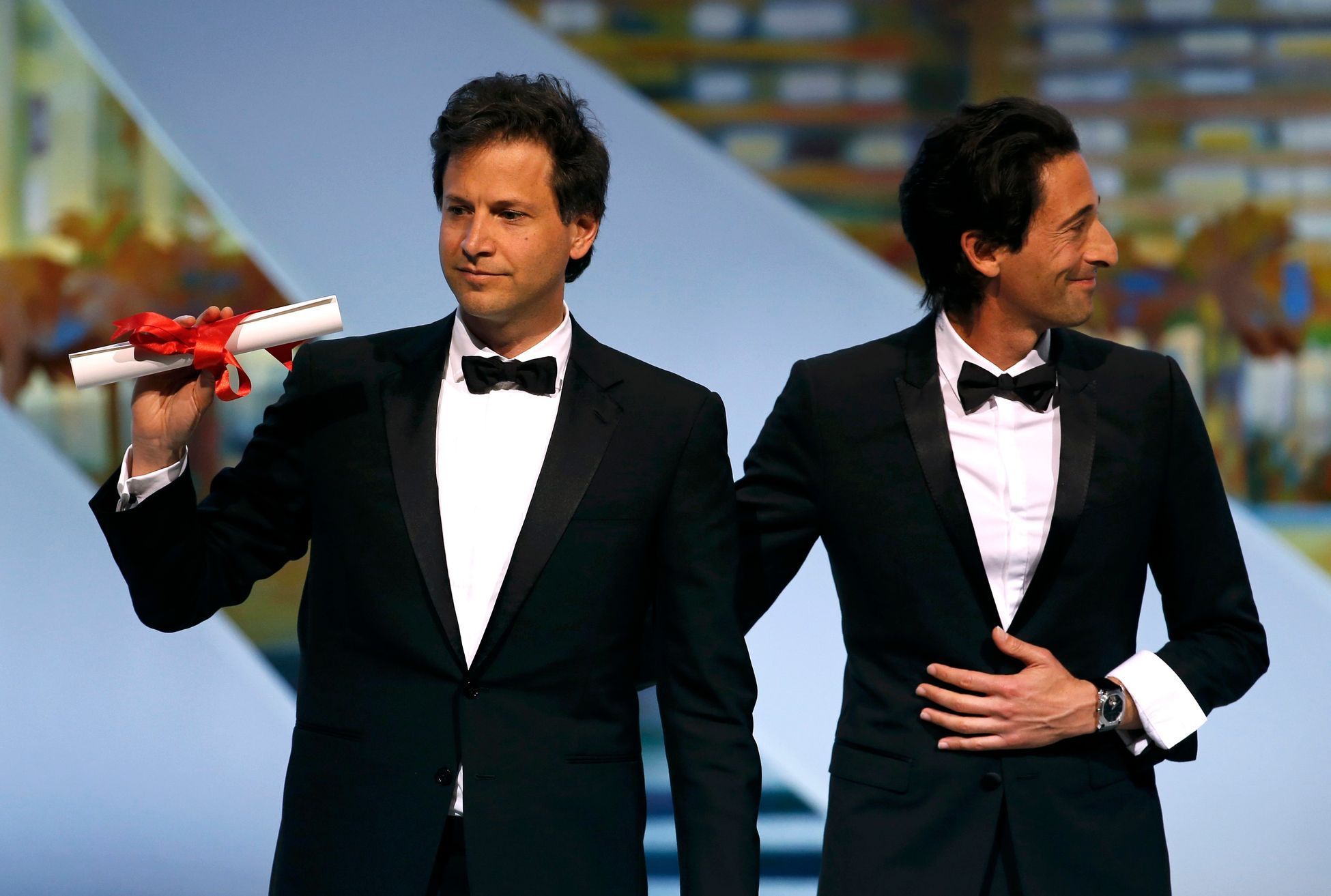 Director Bennett Miller, Best Director award winner for his film &quot;Foxcatcher&quot;, poses on stage with actor Adrien Brody after being awarded during the closing ceremony of the 67th Cannes Film