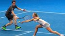 Maria Sharapova (R) and Andy Murray (L) of the Manila Mavericks hit a return to Kristina Mladenovic and Nenad Zimonjic of the UAE Royals during their mixed doubles tennis