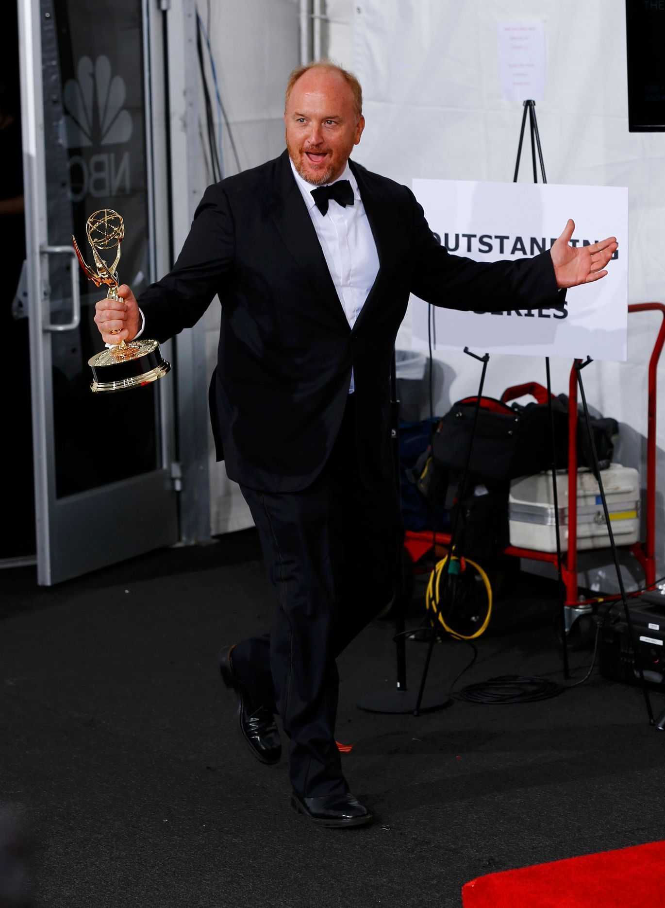 Louis C. K. arrives backstage with his Outstanding writing for a Comedy Series award for the FX Network series &quot;Louie&quot; at the 66th Primetime Emmy Awards in Los Angeles