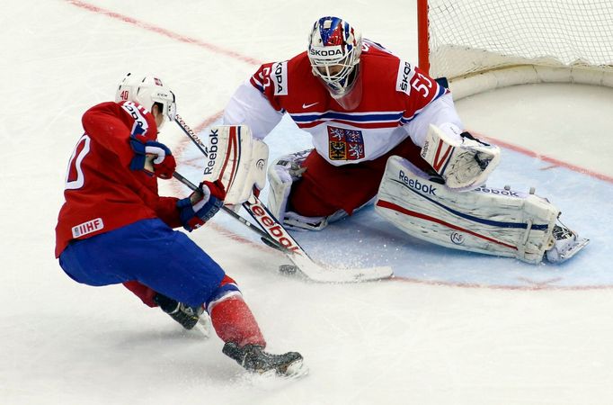 Goalie Alexander Salak of the Czech Republic saves in front of Norway's Ken Andre Olimb (L) during the second period of their men's ice hockey World Championship Group A