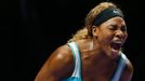 Serena Williams of the U.S. shouts as she wins a point against Caroline Wozniacki of Denmark during their WTA Finals singles semi-finals tennis match at the Singapore Ind