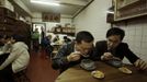 Customers eat snake soup at a snake soup shop in Hong Kong January 30, 2013. There are scores of people in Hong Kong who have through generations tamed snakes to make soup out of them, a traditional cuisine believed to be good for the health. Yet the people behind providing fresh snakes for the savoury meal thought to speed up the body's blood flow and keep it strong in the cold winter months may be doomed, with young people increasingly reluctant to take on a job they see as hard and dirty. Picture taken January 30, 2013. REUTERS/Bobby Yip (CHINA - Tags: ANIMALS FOOD SOCIETY) Published: Úno. 7, 2013, 2:01 odp.