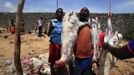 People prepare slaughtered goats on the first day of Eid al-Adha in Somalia's capital Mogadishu, October 26, 2012. Muslims around the world celebrate Eid al-Adha to mark the end of the Haj by slaughtering sheep, goats, cows and camels to commemorate Prophet Abraham's willingness to sacrifice his son Ismail on God's command. REUTERS/Omar Faruk (SOMALIA - Tags: SOCIETY RELIGION ANIMALS) Published: Říj. 26, 2012, 4:10 odp.