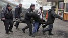 ATTENTION EDITORS - VISUAL COVERAGE OF SCENES OF INJURY OR DEATH - A wounded protester is rushed to a vehicle following violence in Independence Square in Kiev February 2