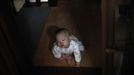 Lee Sae-byeok, 3, who was abandoned at a "baby box" at Joosarang church, is seen at the church in Seoul September 20, 2012.Pastor Lee Jong-rak, who runs the "baby box" where mothers can leave unwanted infants, has seen a sharp increase in the number of newborns being left there because, the pastor says, of a new law aimed protecting the rights of children. South Korea is trying to shed a reputation of being a source of babies for adoption by people abroad. It is encouraging domestic adoption and tightening up the process of a child's transfer from birth mother to adoptive parents. Picture taken September 20, 2012. REUTERS/Kim Hong-Ji (SOUTH KOREA - Tags: SOCIETY) Published: Říj. 7, 2012, 6:57 dop.