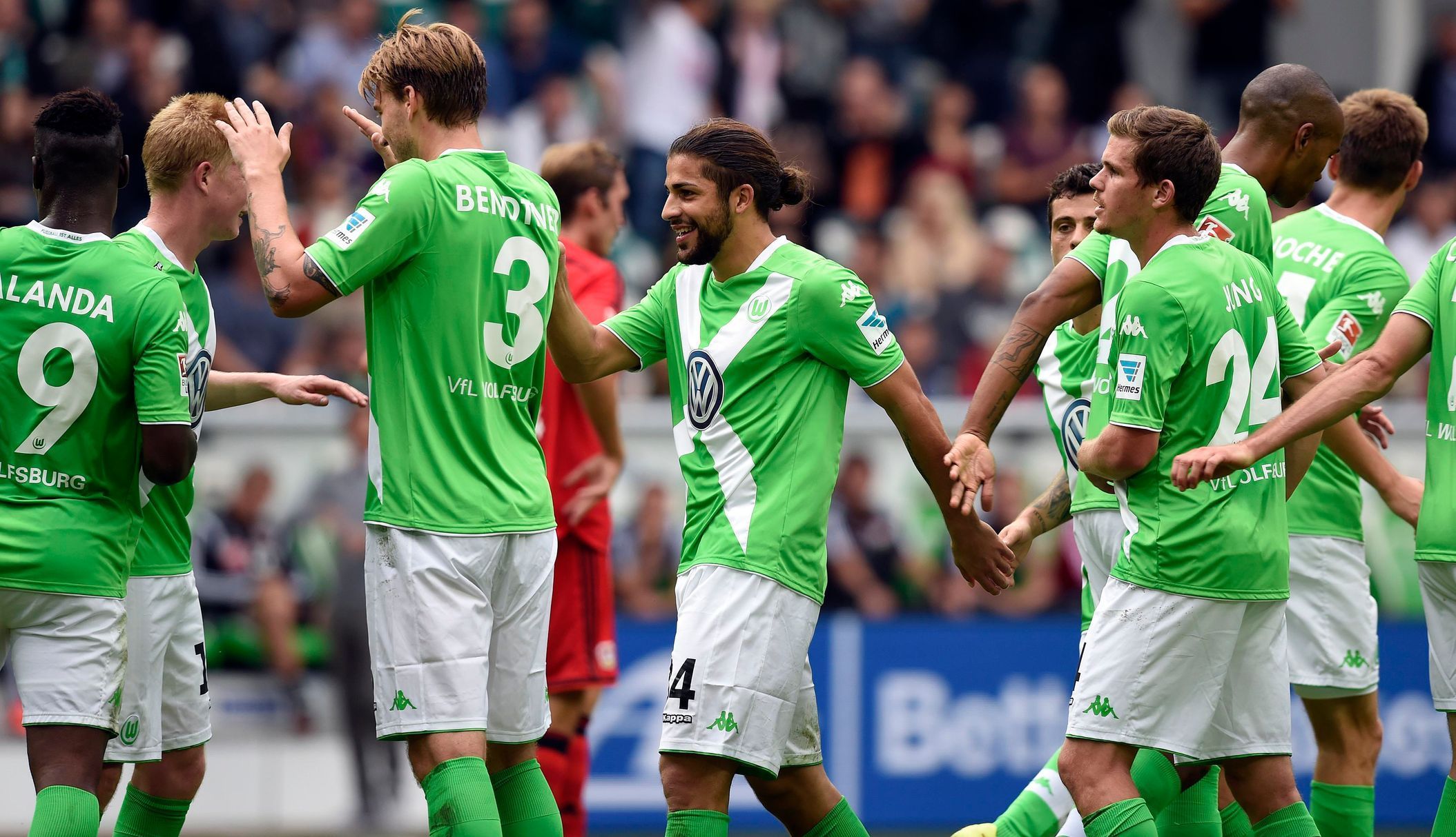 VfL Wolfburg's Ricardo Rodriguez celebrates with teammates after scoring against Bayer Leverkusen during the German Bundesliga first division soccer match in Wolfsbur