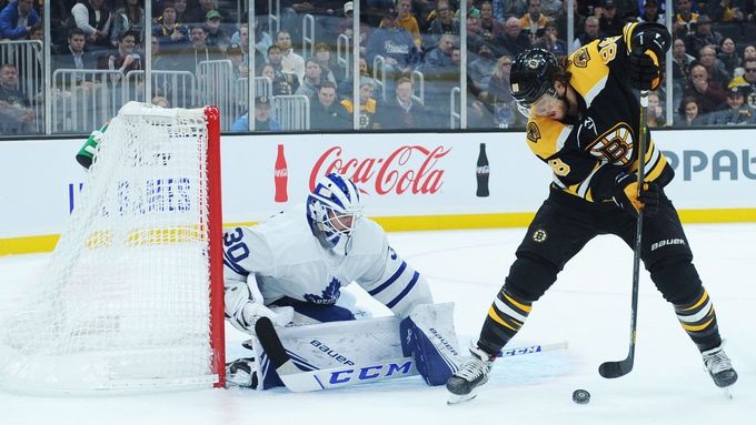 Oct 22, 2019; Boston, MA, USA; Boston Bruins right wing David Pastrňák (88) puts the puck between his legs in front of Toronto Maple Leafs goaltender Michael Hutchinson (