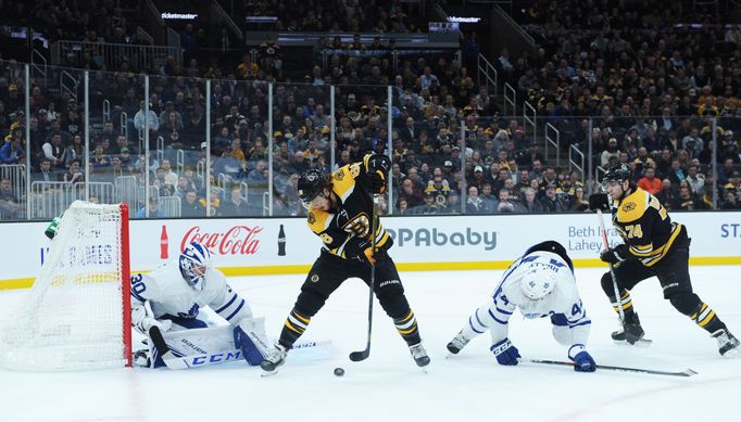 Oct 22, 2019; Boston, MA, USA; Boston Bruins right wing David Pastrňák (88) puts the puck between his legs in front of Toronto Maple Leafs goaltender Michael Hutchinson (