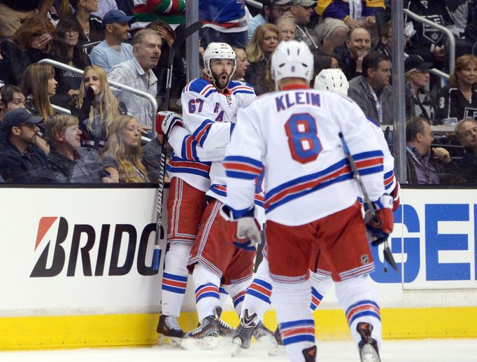 Jun 4, 2014; Los Angeles, CA, USA; New York Rangers left wing Benoit Pouliot (67) celebrates scoring a goal against the Los Angeles Kings during the first period during g