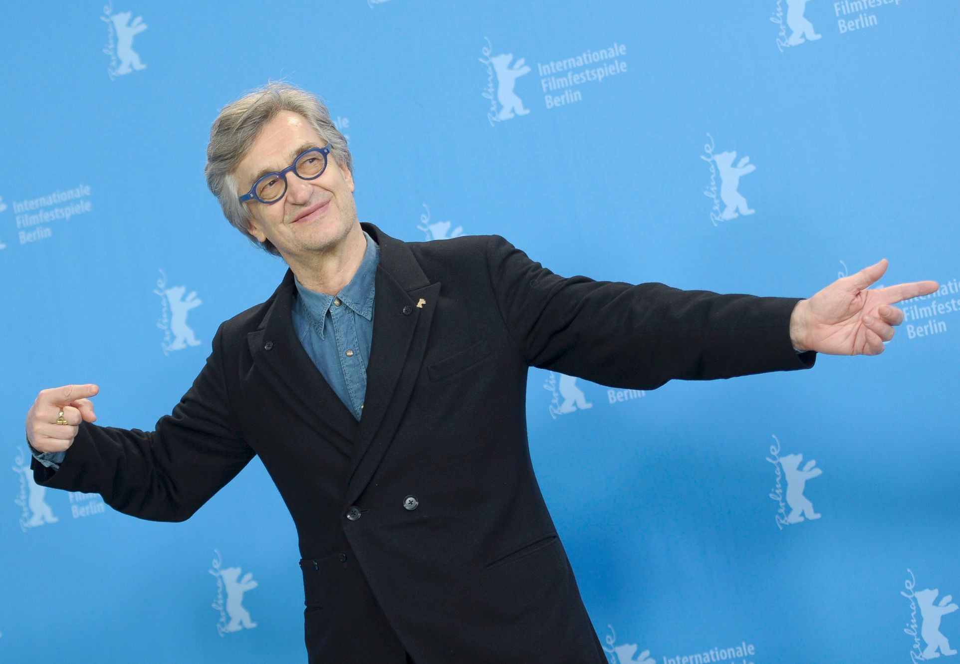 Director Wenders poses during a photocall at the 65th Berlinale International Film Festival in Berlin