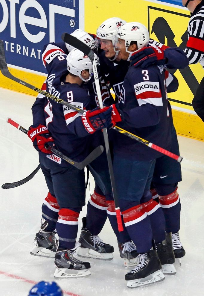 Brock Nelson of the U.S. (2nd R) celebrates his goal against Finland with team mates during the first period of their men's ice hockey World Championship Group B game at