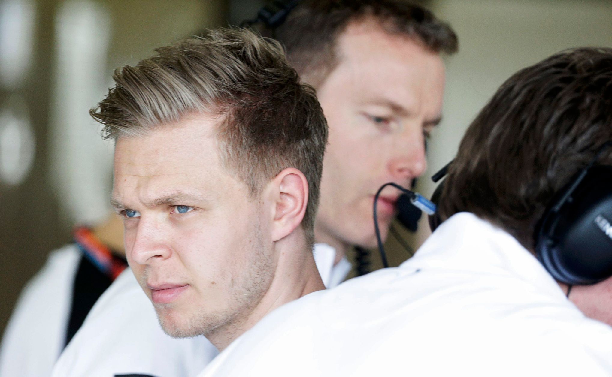 McLaren Formula One driver Kevin Magnussen of Denmark looks on in the team garage during the third practice session of the Australian F1 Grand Prix at the Albert Park circuit in Melbourne