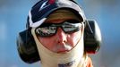 Marussia Formula One driver Max Chilton of Britain is reflected in the sunglasses of a race official during the second practice session of the Australian F1 Grand Prix at