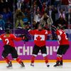 Canada's Poulin celebrates her gold medal winning goal against Team USA with teammates Agosta-Marciano and Wickenheiser in overtime in the women's ice hockey gold medal game at the 2014 Sochi Winter O