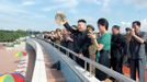 North Korean leader Kim Jong-Un and his wife Ri Sol-Ju attend the opening ceremony of the Rungna People's Pleasure Ground on Rungna Islet along the Taedong River in Pyongyang in this July 25, 2012 photograph released by the North's KCNA to Reuters on July 26, 2012.The Rungna People's Pleasure Ground has attractions such as a dolphinarium, a wading pool, a fun fair and a mini golf course, according to KCNA. REUTERS/KCNA (NORTH KOREA - Tags: POLITICS SOCIETY) FOR EDITORIAL USE ONLY. NOT FOR SALE FOR MARKETING OR ADVERTISING CAMPAIGNS. THIS IMAGE HAS BEEN SUPPLIED BY A THIRD PARTY. IT IS DISTRIBUTED, EXACTLY AS RECEIVED BY REUTERS, AS A SERVICE TO CLIENTS. NO THIRD PARTY SALES. NOT FOR USE BY REUTERS THIRD PARTY DISTRIBUTORS Published: Čec. 26, 2012, 3:28 dop.