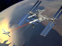 Kresba znázorňuje evropskou automatickou kosmickou loď ATV, jak se - naváděna pomocí laserových zaměřovačů - přibližuje k Mezinárodní vesmírné stanici.