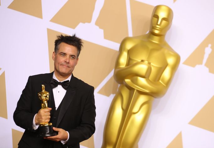 Director Sebastian Lelio from Chile holds the Oscar for Best Foreign Language Film