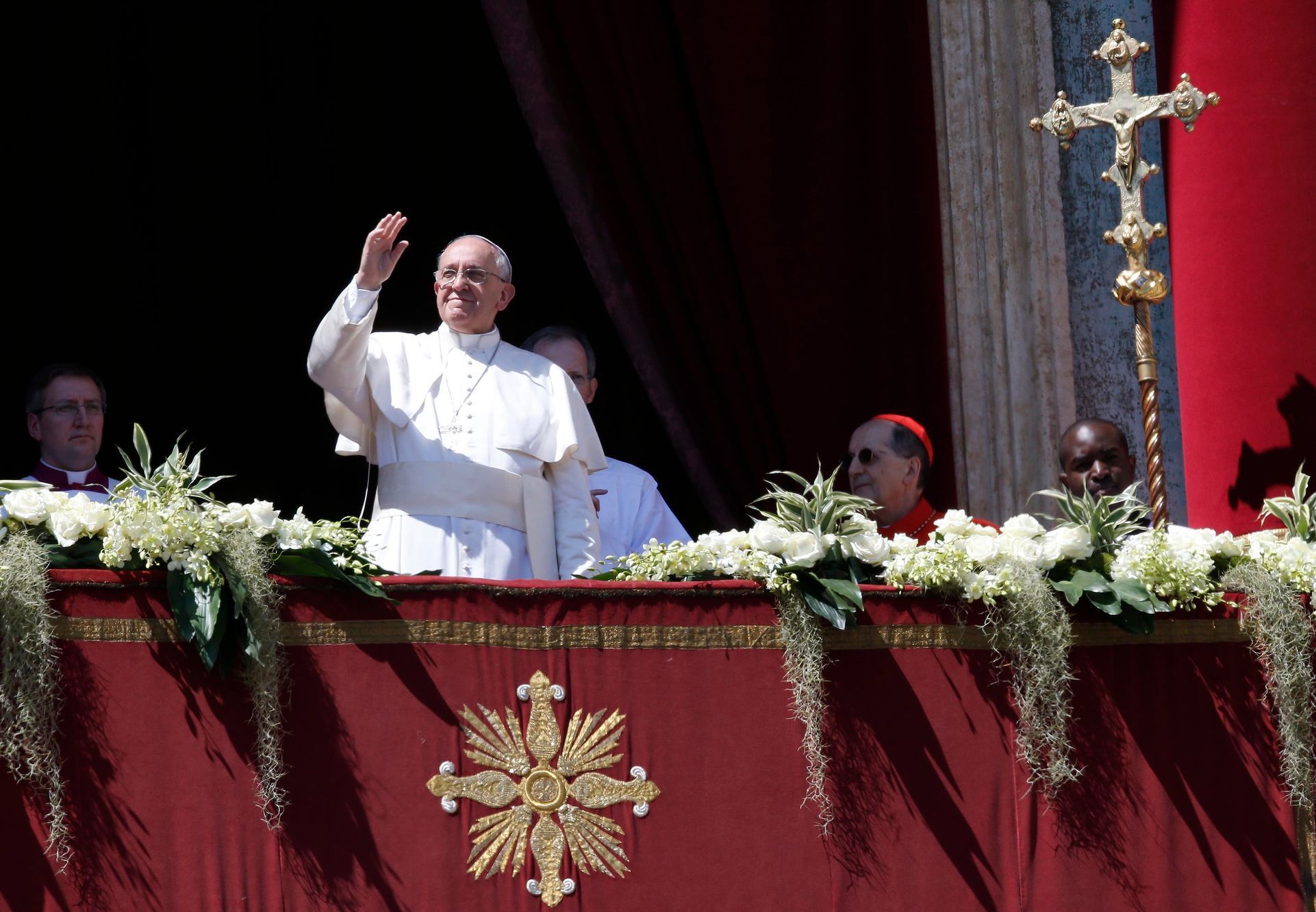 Pope Francis waves as he arrives to deliver the Urbi et Orbi (to the city and the world) benediction at the end of the Easter Mass in Saint Peter's Square at the Vatican