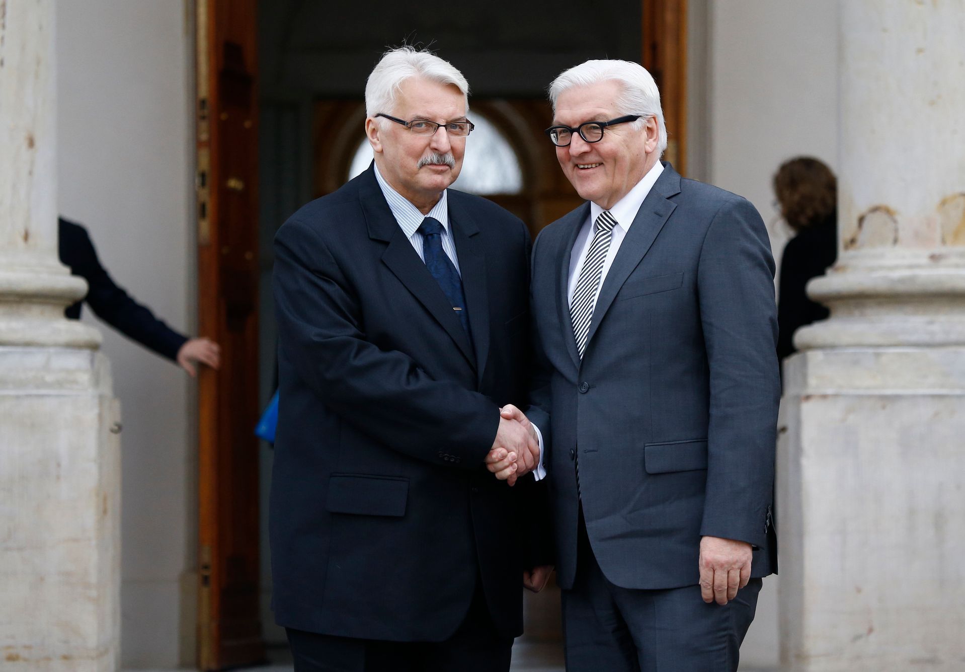 Polish Foreign Minister Waszczykowski shakes hands with his German counterpart Steinmeier at the Lazienki Palace in Warsaw