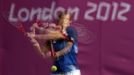 Britain's Andy Murray returns the ball during a training session at the All England Lawn Tennis Club ahead of the London 2012 Olympic Games in London July 25, 2012. Picture taken using multiple exposures. REUTERS/Stefan Wermuth (BRITAIN - Tags: SPORT OLYMPICS TENNIS) Published: Čec. 25, 2012, 4:52 odp.