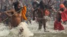 Naga Sadhus or Hindu Holymen take a dip during the first "Shahi Snan" (grand bath) at the ongoing "Kumbh Mela", or Pitcher Festival, in the northern Indian city of Allahabad January 14, 2013. Upwards of a million elated Hindu holy men and pilgrims took a bracing plunge in India's sacred Ganges river to wash away lifetimes of sins on Monday, in a raucous start to an ever-growing religious gathering that is already the world's largest. REUTERS/Ahmad Masood (INDIA - Tags: RELIGION SOCIETY) TEMPLATE OUT Published: Led. 14, 2013, 1:39 odp.