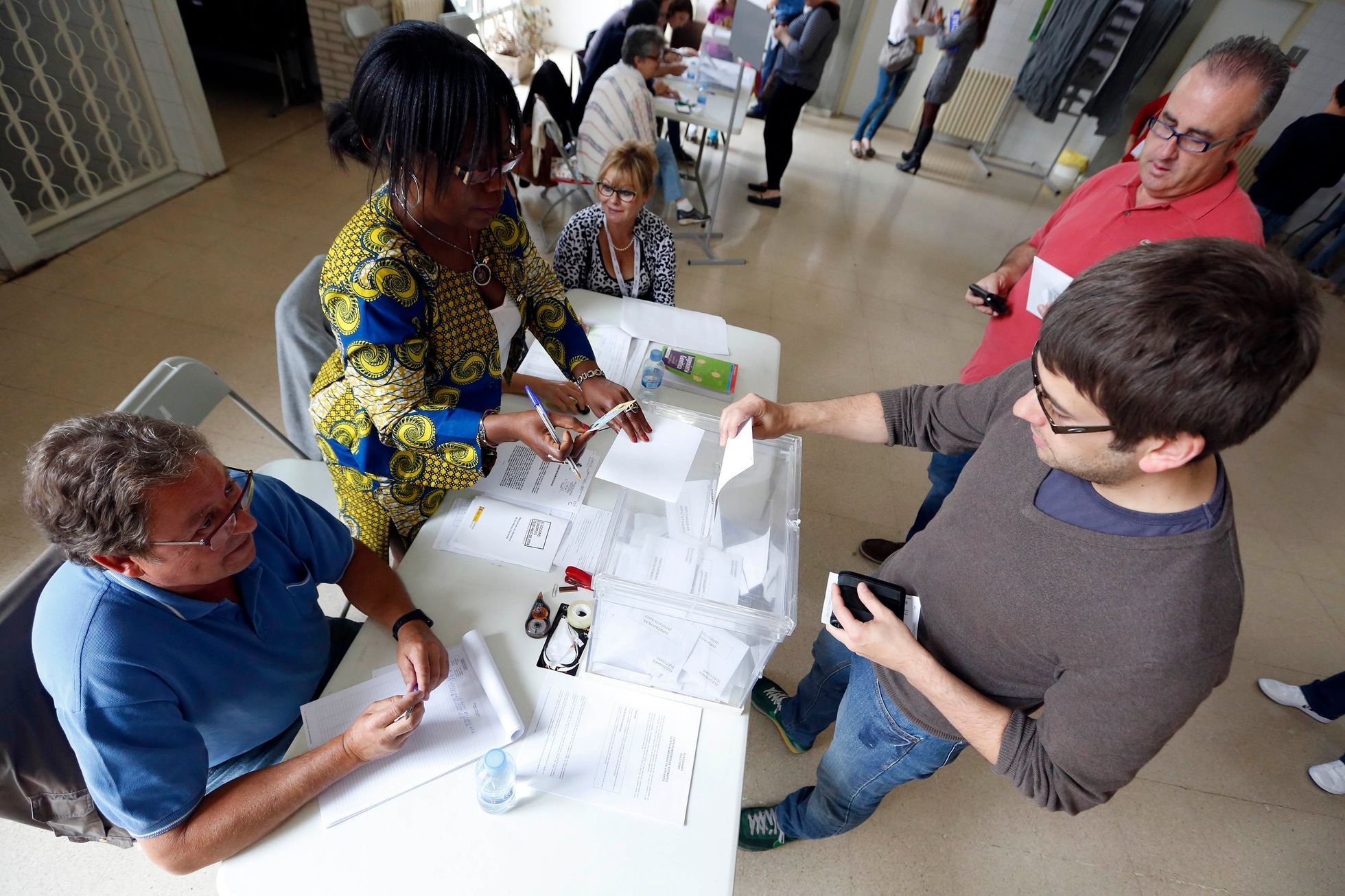 A man casts his ballot during the European Parliament elections at a polling station in El Masnou, near Barcelona