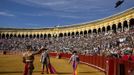 Spanish matador Jose Maria Manzanares throws a hat as he celebrates his performance during a bullfight in Seville