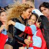 Beyonce hugs performers after performing in the half-time show during the NFL's Super Bowl 50 football game between the Carolina Panthers and the Denver Broncos in Santa Clara