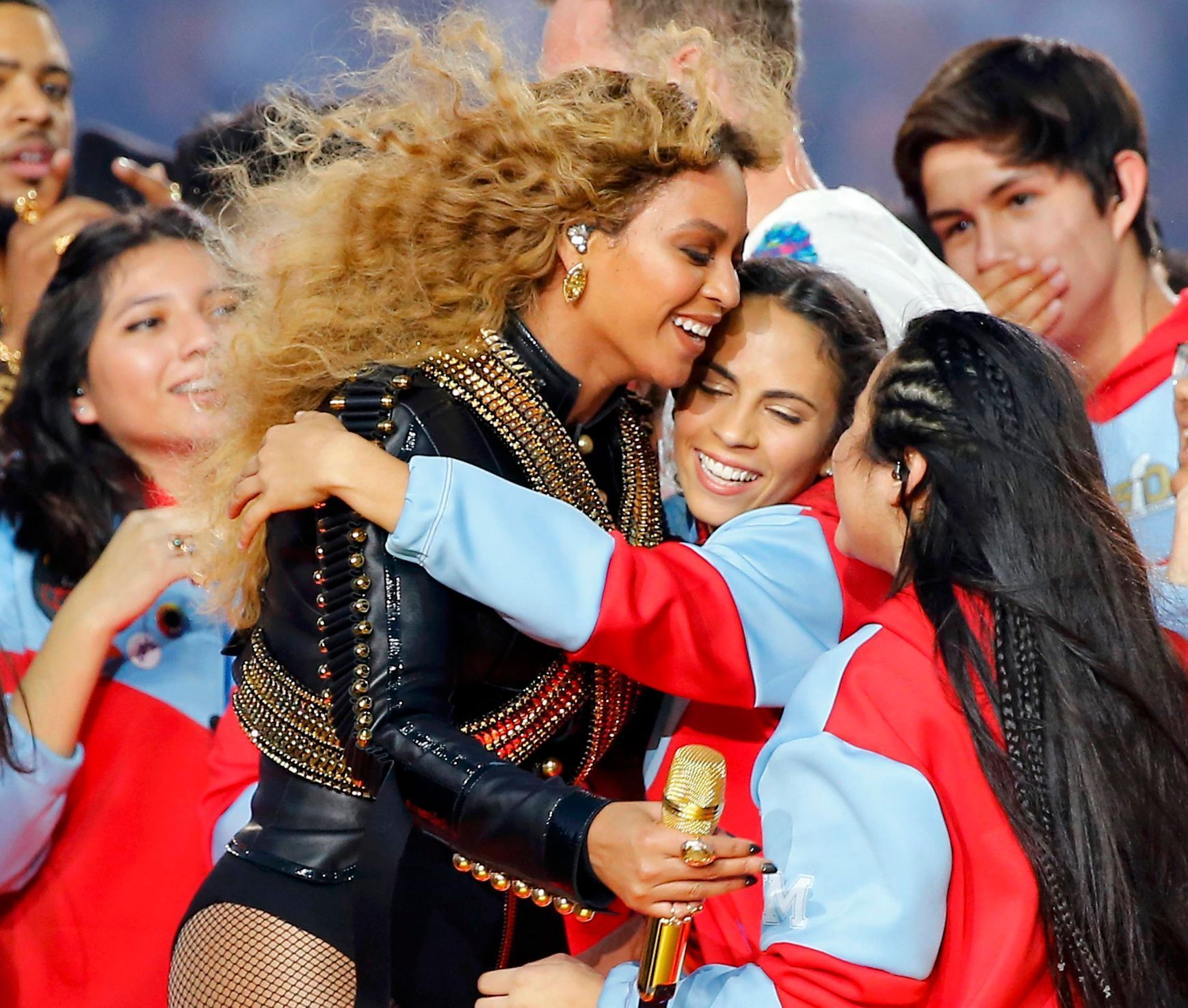 Beyonce hugs performers after performing in the half-time show during the NFL's Super Bowl 50 football game between the Carolina Panthers and the Denver Broncos in Santa Clara