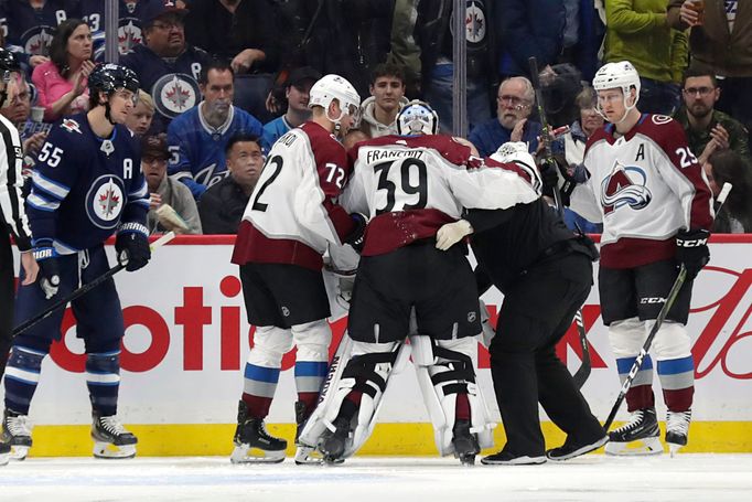 Nov 12, 2019; Winnipeg, Manitoba, CAN; Colorado Avalanche goaltender Pavel Francouz (39) is helped off the ice after being injured in the first minute in the game against