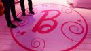 This picture taken on April 12, 2013 shows visitors during a press presentation of the 'Barbie Dreamhouse, in Berlin. The opening this month of the first life-sized Barbie Dreamhouse in Europe may be many little girls' fantasy, but Berlin feminists are mobilising against what they call a sexist icon.