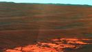 Endeavour on the Horizon (False Color) NASA's Mars Exploration Rover Opportunity used its panoramic camera (Pancam) to capture this view of the rim of Endeavour crater, the rover's destination in a multi-year traverse along the sandy Martian landscape. The image was taken during the 2,226 Martian day, or sol, of Opportunity's mission on Mars (April 28, 2010). Endeavour is 21 kilometers (13 miles) in diameter, about 25 times wider than Victoria crater, the last major crater Opportunity visited. This image shows an outcrop of rocks at the foot of the rover and beyond these rocks rippled dunes, which are about 20 centimeters (8 inches) tall. The west rim of Endeavour, about 13 kilometers (8 miles) away, appears on the left on the horizon. The rim of smaller, more-distant Iazu crater, which is 7 kilometers (4 miles) in diameter and about 35 kilometers (22 miles) away, is on the far right. On the horizon in between is a blanket of material ejected from the impact that created Iazu crater, and darker features that are portions of the west and southwest rim of Endeavour. Opportunity began a marathon from Victoria to Endeavour in September 2008 after spending two years exploring Victoria. The intended route, about 19 kilometers (12 miles) long, has headed south before turning east in order to bypass potentially hazardous sand ripples to the east, larger than the ripples in this image. This view is presented in false color, which is used to emphasize differences in surface materials. It combines three exposures taken through filters admitting wavelengths of 750 nanometers, 530 nanometers and 430 nanometers. Image Credit: NASA/JPL/Cornell/University of Arizona