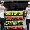 McLaren Formula One driver Button celebrates his 250th Grand Prix with team mate Magnussen before the Bahrain F1 Grand Prix at the Bahrain International Circuit